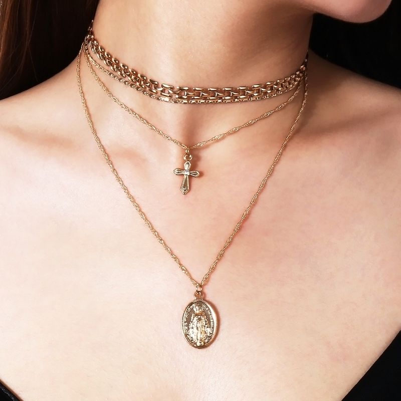 Madonna and silver cross necklace